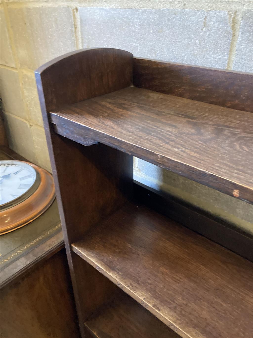 An early 20th century Wylie and Lochead style oak open bookcase, length 95cm, depth 26cm, height 130cm